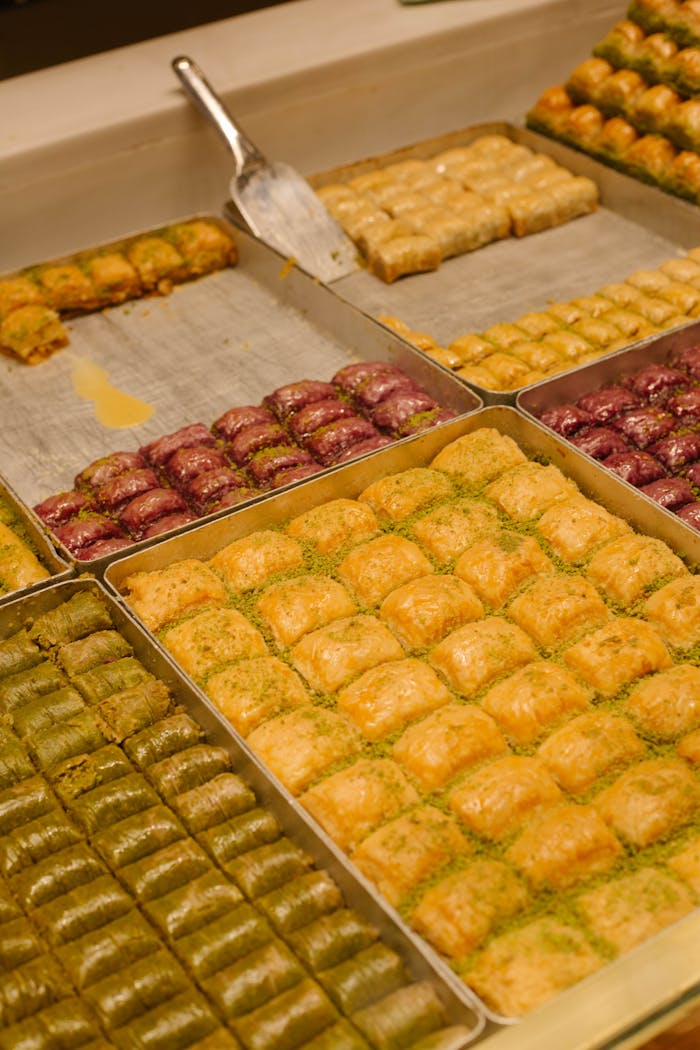 A mouth-watering assortment of Turkish baklava varieties in a bakery in Istanbul.